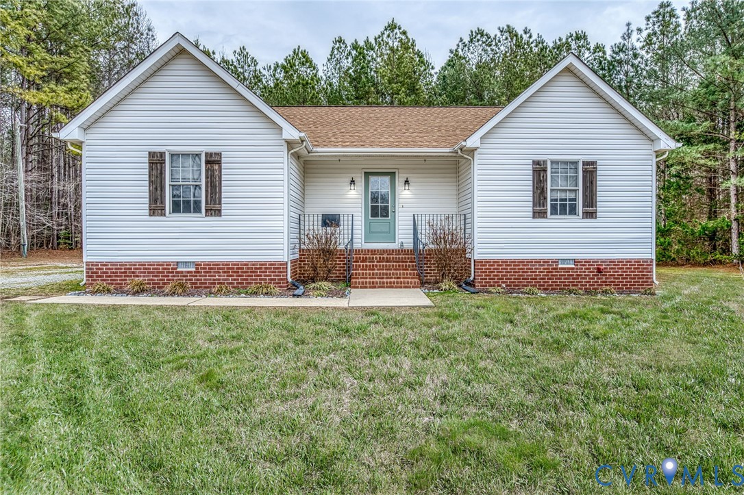 7045 Tranquility Lane Sutherland, VA 23885 - Photo 5 of 27 a view of front of a house with a yard