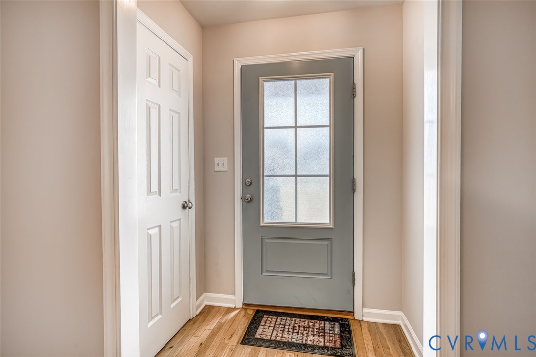 7045 Tranquility Lane Sutherland, VA 23885 - Photo 6 of 27 a view of a room that has a window and wooden floor