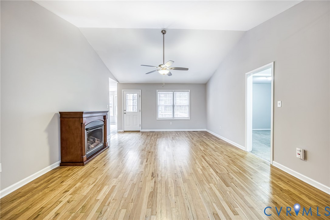 7045 Tranquility Lane Sutherland, VA 23885 - Photo 7 of 27 wooden floor in an empty room with a window