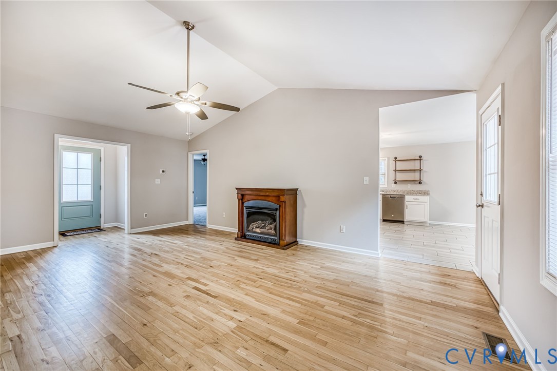 7045 Tranquility Lane Sutherland, VA 23885 - Photo 8 of 27 a view of an empty room with a window and fireplace
