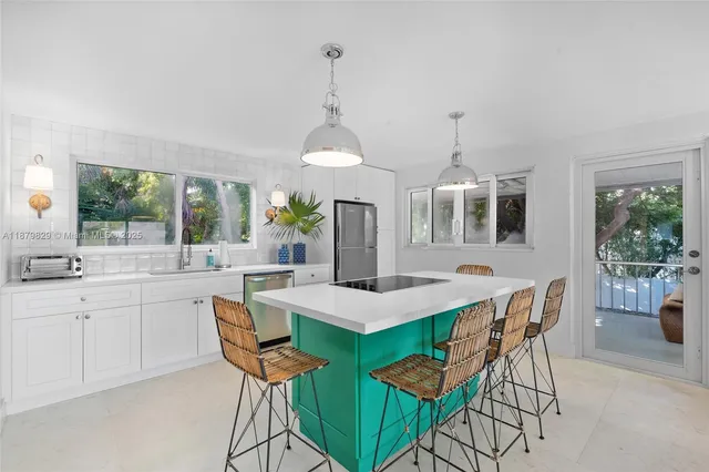 a view of a dining room with furniture window and outside view