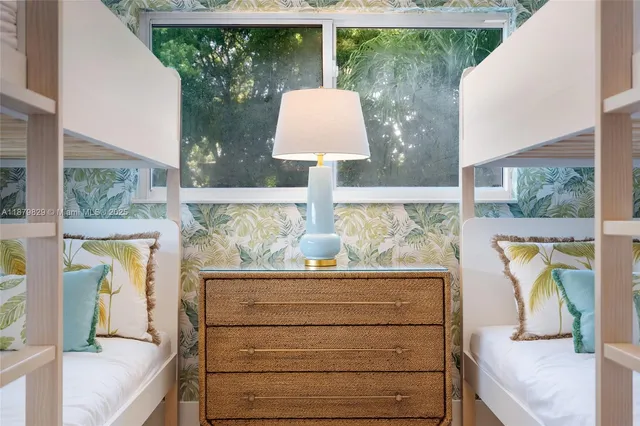 a front view of a house with a large window