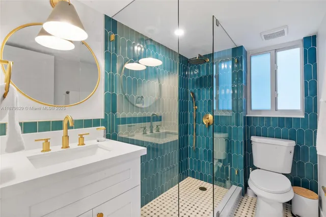 a bathroom with a sink a toilet and a mirror