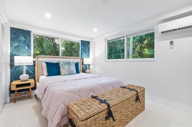 a bedroom with a bed and a fireplace