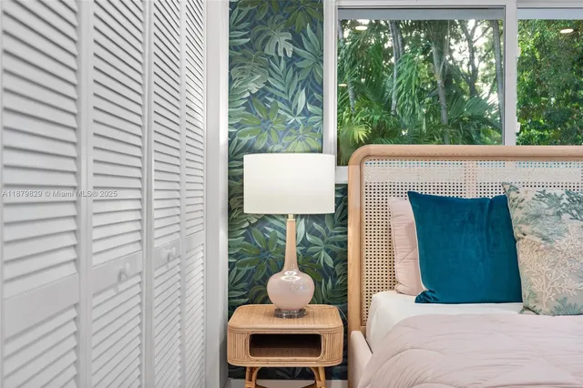 a bedroom with a bed and chair