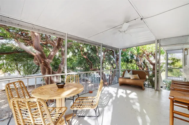 a view of a patio with a table chairs and a table