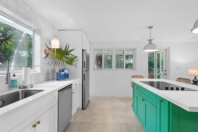a kitchen with a sink and a stove