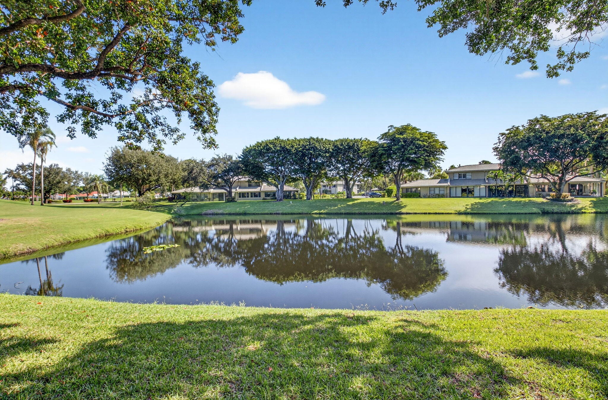 3 Westgate Lane, Unit C Boynton Beach, FL 33436 - Photo 11 of 98 a view of a lake with a big yard