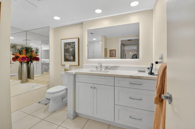 a kitchen with stainless steel appliances granite countertop a sink a stove and a microwave