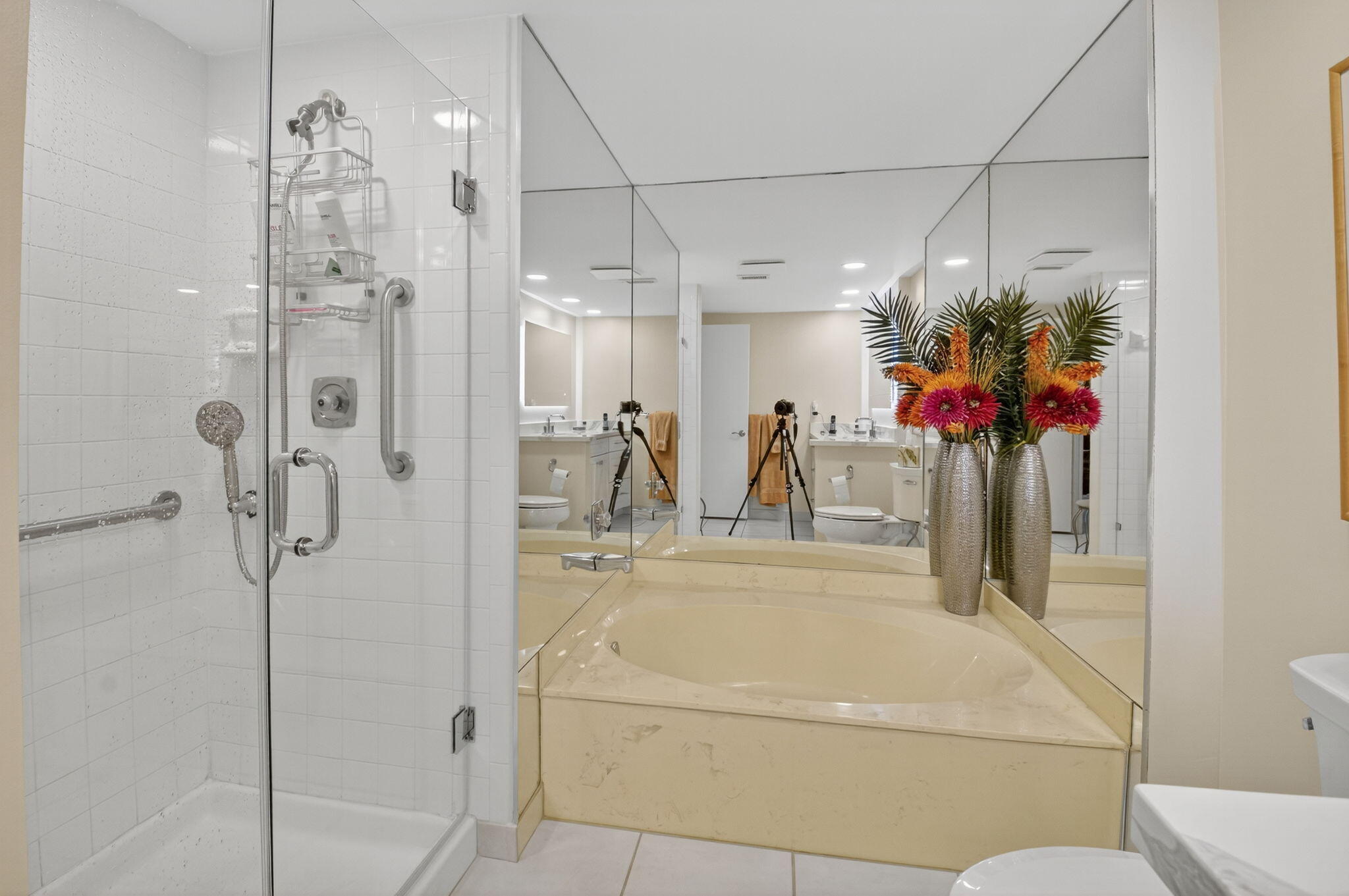 3 Westgate Lane, Unit C Boynton Beach, FL 33436 - Photo 35 of 98 a bathroom with a tub sink mirror and toilet