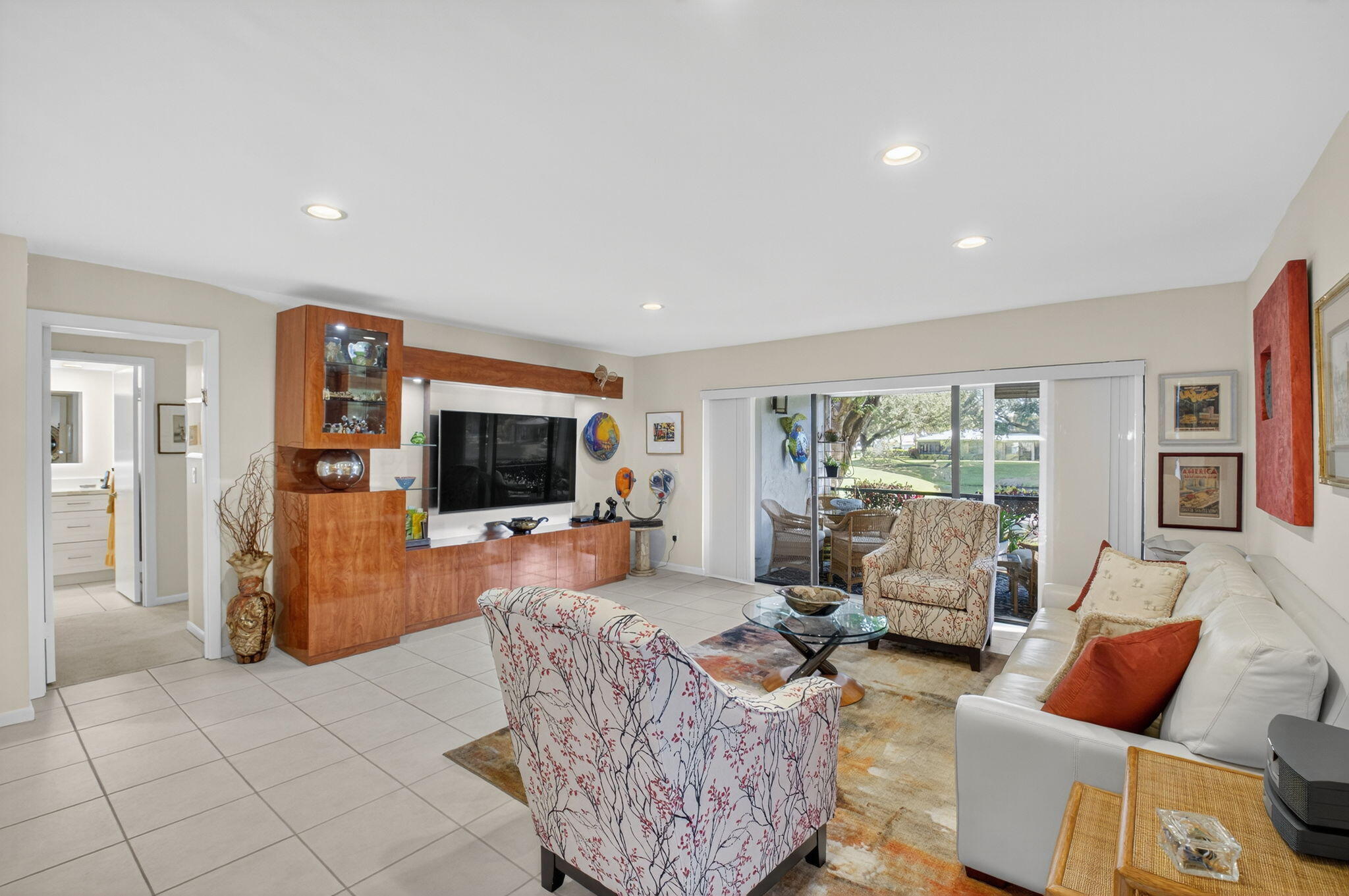 3 Westgate Lane, Unit C Boynton Beach, FL 33436 - Photo 7 of 98 a living room with furniture and a flat screen tv