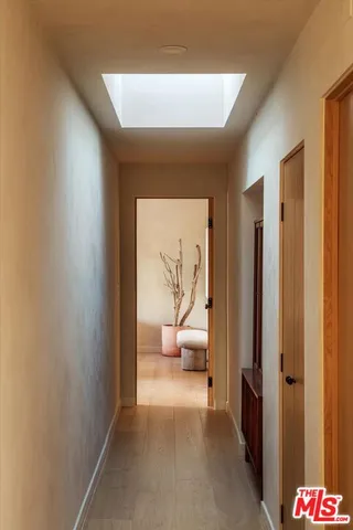 a view of a hallway with bathroom