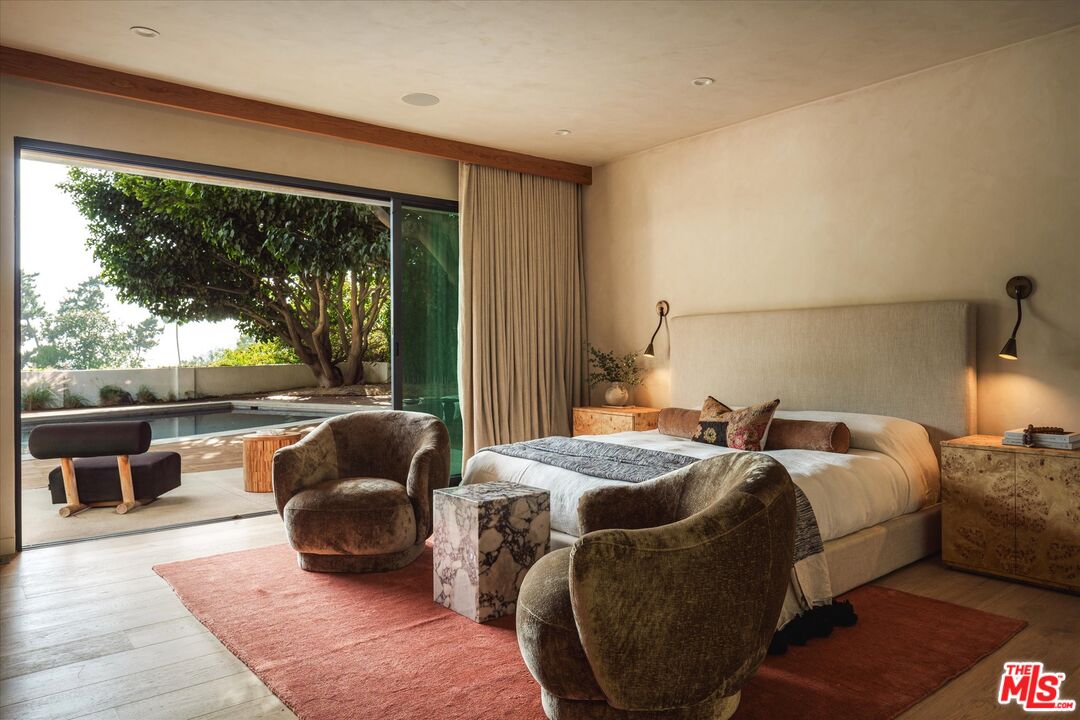 1820 Rising Glen Road Los Angeles, CA 90069 - Photo 19 of 30 a bed room with a bed and a couch