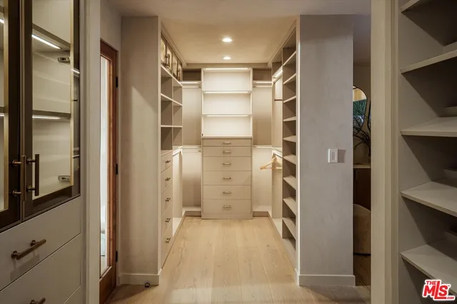 a bathroom with a glass shower door and a bathtub