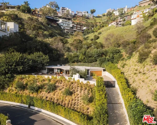 a view of a balcony with two chairs and a table