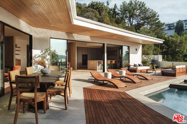 a view of a patio with chairs and tables