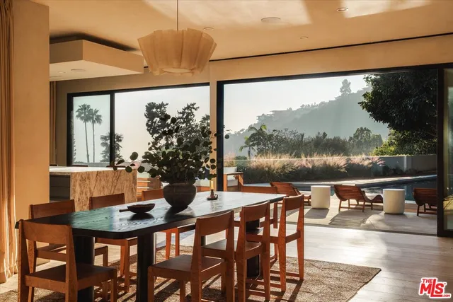 a view of a dining room with furniture window and outside view