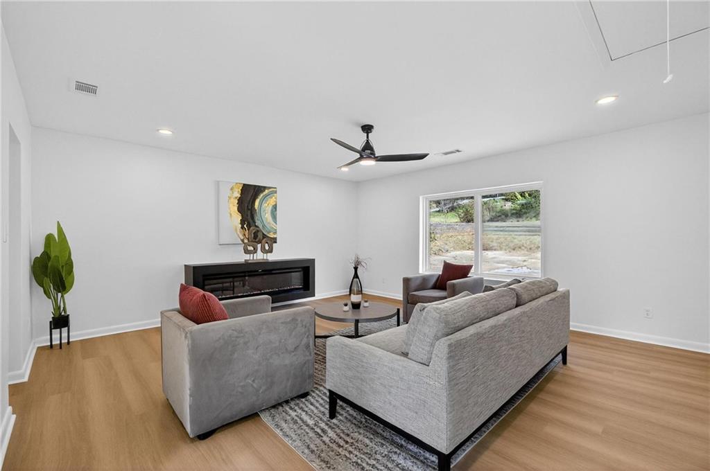 2967 Flat Shoals Road Decatur, GA 30034 - Photo 13 of 37 a living room with furniture and a window