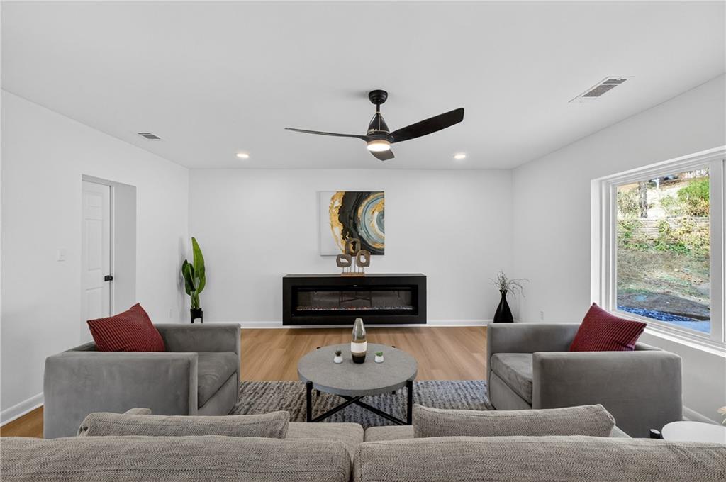 2967 Flat Shoals Road Decatur, GA 30034 - Photo 14 of 37 a living room with furniture and a window