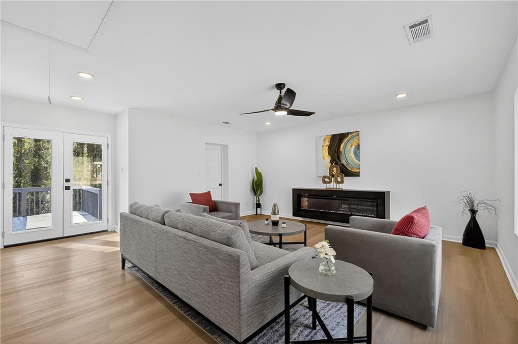 2967 Flat Shoals Road Decatur, GA 30034 - Photo 15 of 37 a living room with furniture and a wooden floor