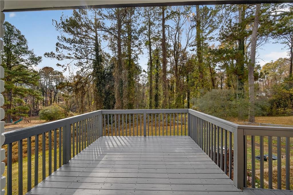 2967 Flat Shoals Road Decatur, GA 30034 - Photo 18 of 37 a deck with trees in front of it