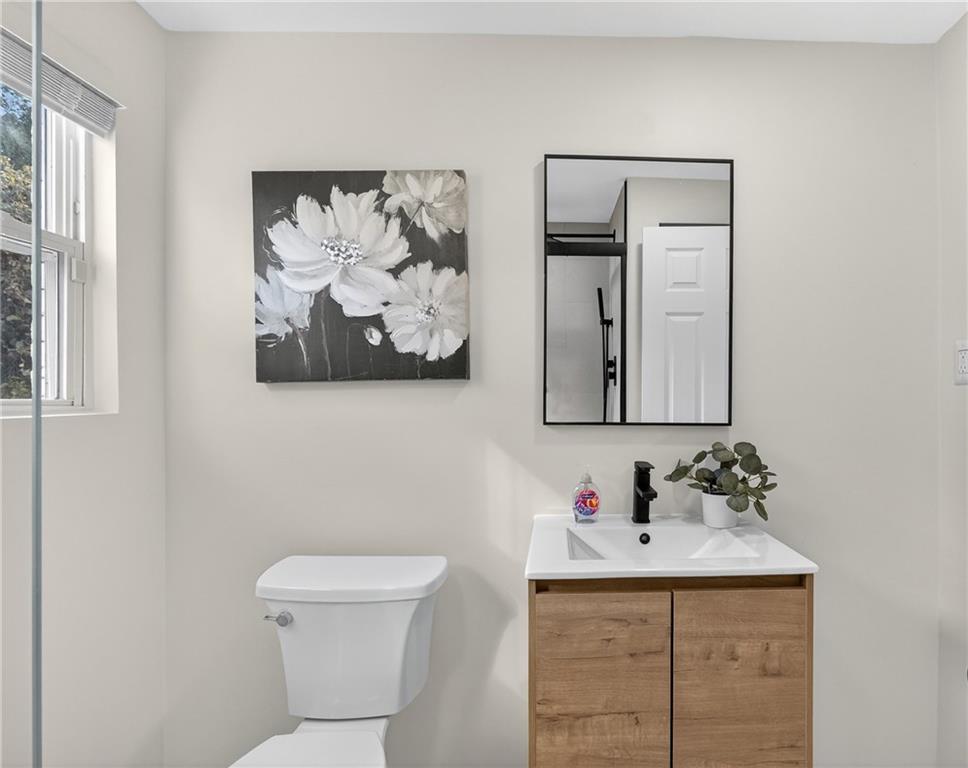 2967 Flat Shoals Road Decatur, GA 30034 - Photo 22 of 37 a bathroom with a toilet sink and mirror