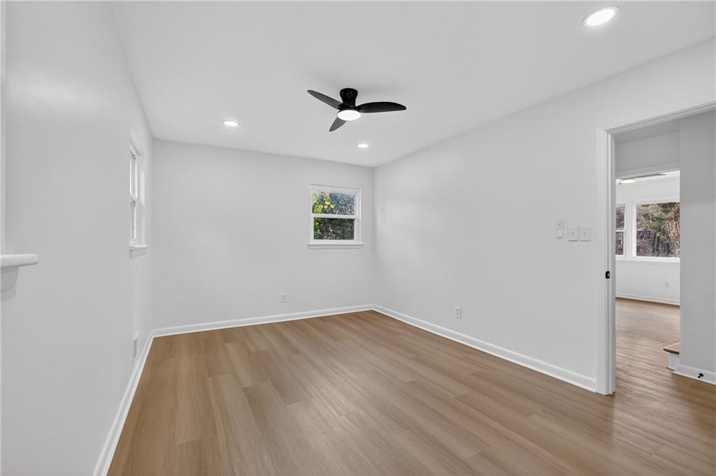 2967 Flat Shoals Road Decatur, GA 30034 - Photo 26 of 37 wooden floor in an empty room with a window