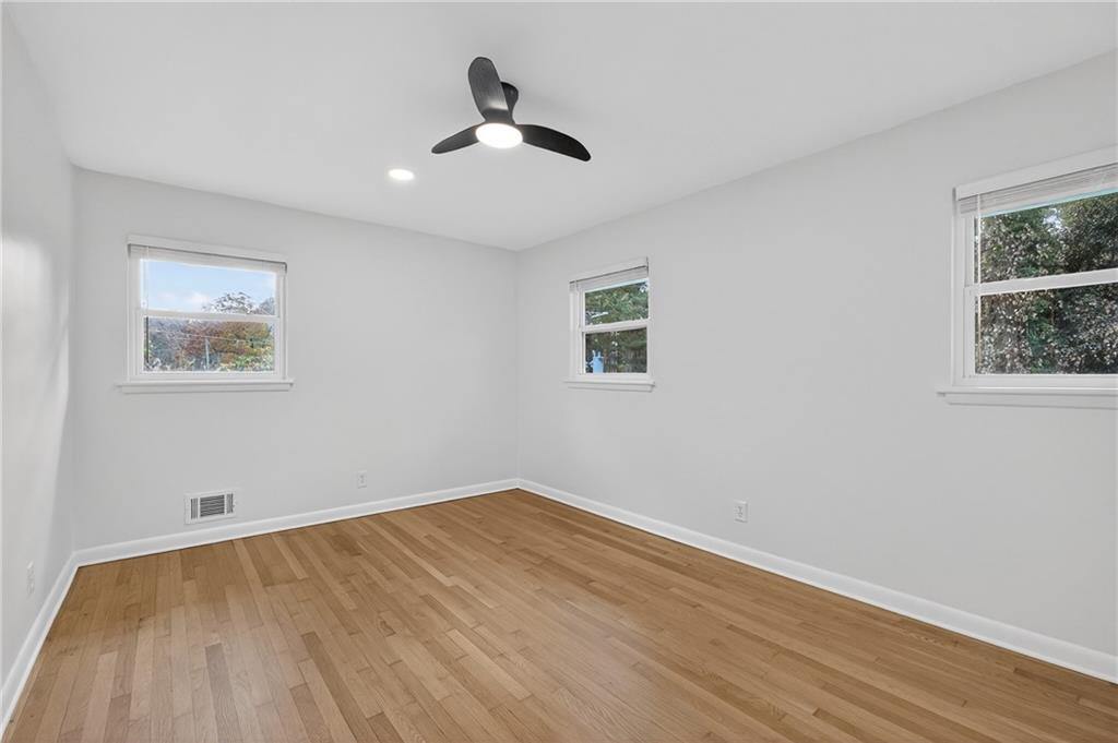 2967 Flat Shoals Road Decatur, GA 30034 - Photo 27 of 37 a view of empty room with wooden floor and fan