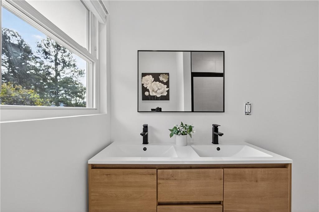 2967 Flat Shoals Road Decatur, GA 30034 - Photo 30 of 37 a bathroom with a sink and a mirror