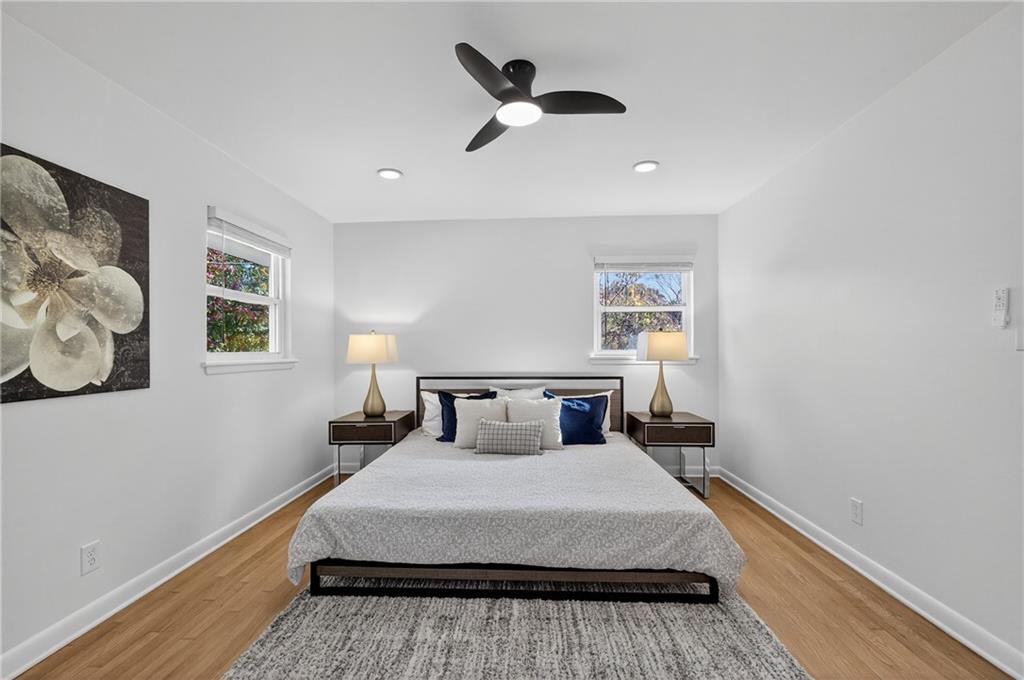 2967 Flat Shoals Road Decatur, GA 30034 - Photo 33 of 37 a bedroom with a bed and painting on the wall