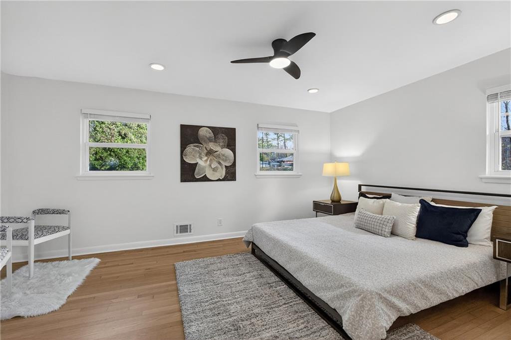 2967 Flat Shoals Road Decatur, GA 30034 - Photo 34 of 37 a bedroom with a bed and a painting on the wall