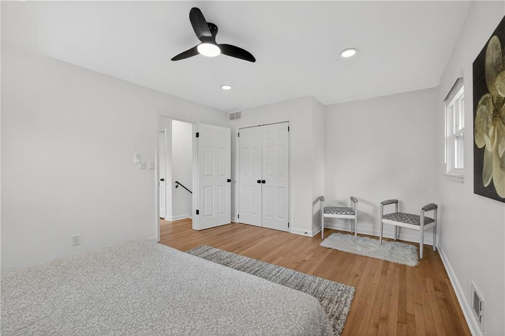 2967 Flat Shoals Road Decatur, GA 30034 - Photo 35 of 37 a bedroom with a bed and a chandelier