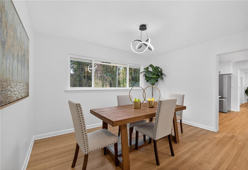 2967 Flat Shoals Road Decatur, GA 30034 - Photo 6 of 37 a view of a dining room with furniture window and wooden floor