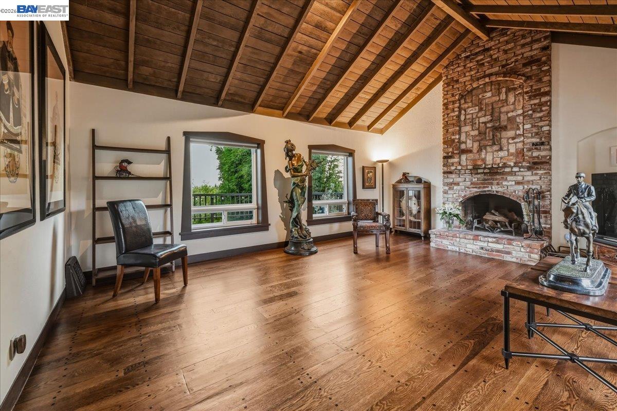 22111 Prospect Street Hayward, CA 94541 - Photo 8 of 70 a living room with furniture large windows and a fireplace