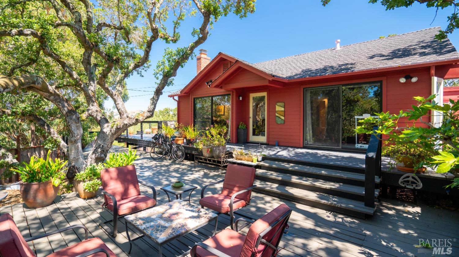 6 Farvue Road Novato, CA 94947 - Photo 1 of 1 a view of a chairs and table in a backyard