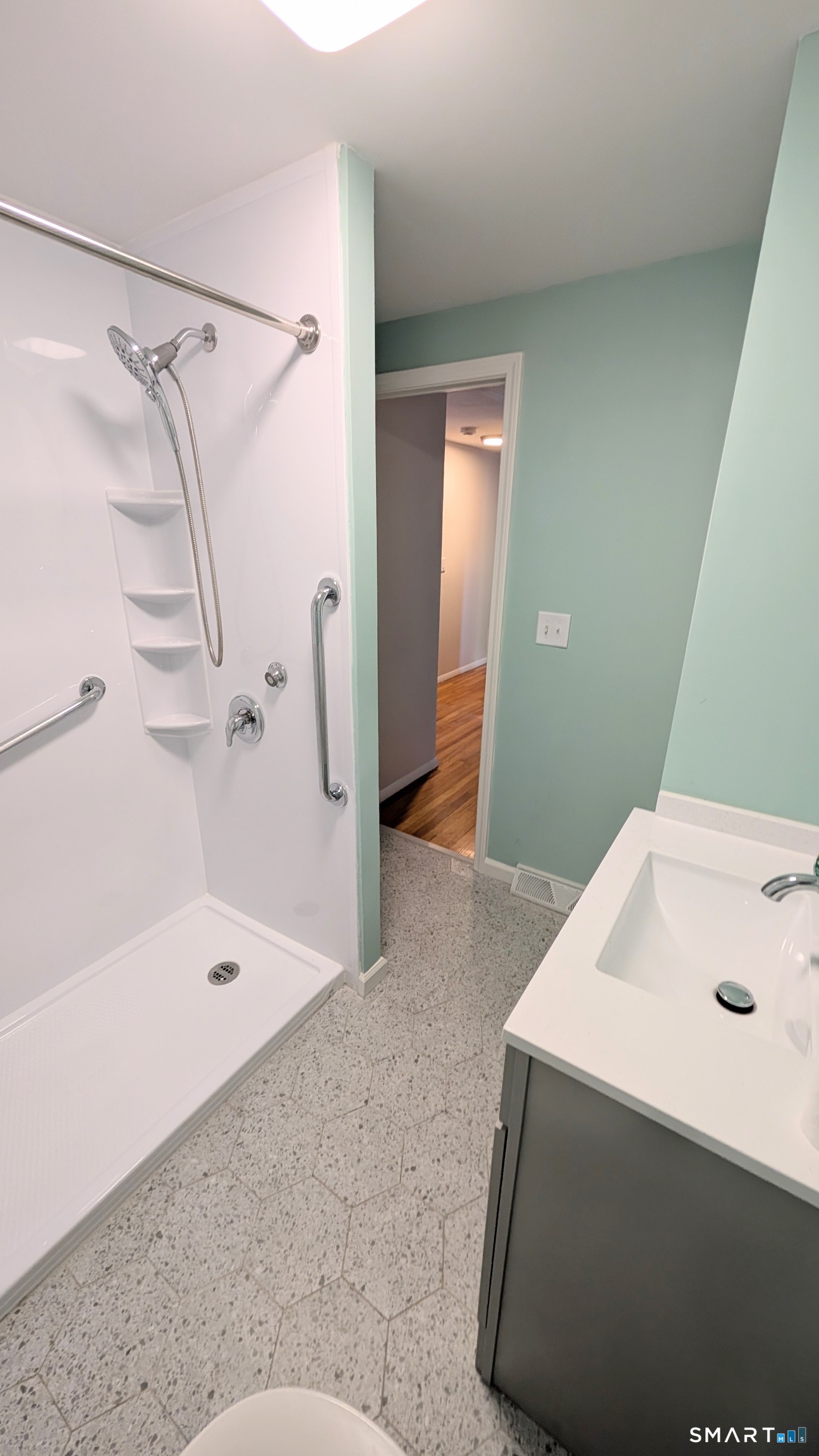21 Rondy Lane East Hartford, CT 06108 - Photo 22 of 28 Shower with small step and grab bars