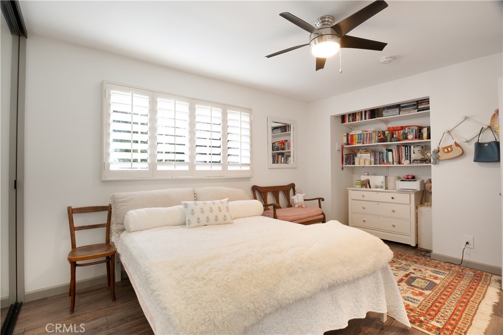 419 Gloucester Drive Costa Mesa, CA 92627 - Photo 13 of 51 a bedroom with a bed and a book shelf