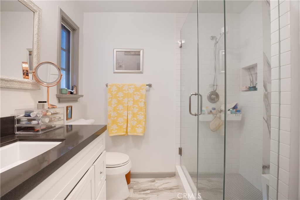 419 Gloucester Drive Costa Mesa, CA 92627 - Photo 17 of 51 a bathroom with a sink a toilet and shower