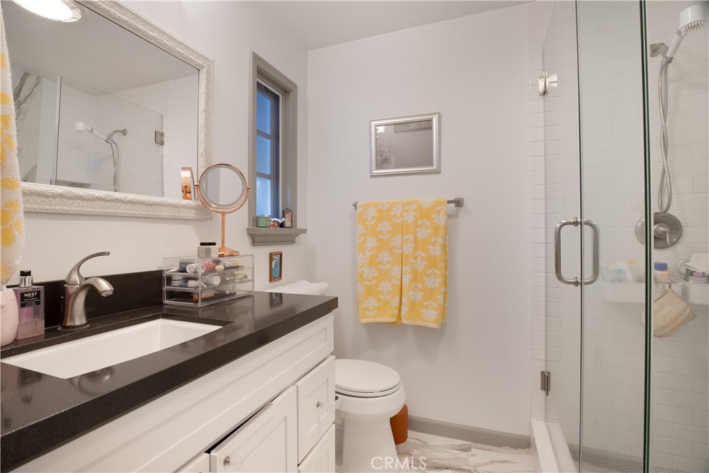 419 Gloucester Drive Costa Mesa, CA 92627 - Photo 18 of 51 a bathroom with a sink and a mirror