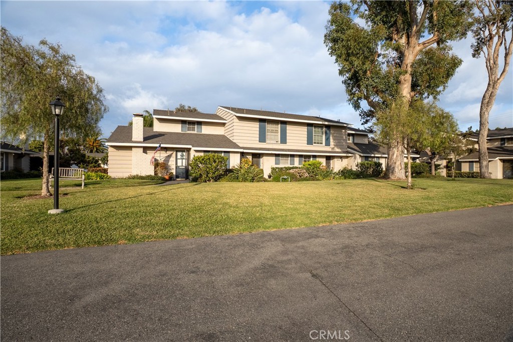 419 Gloucester Drive Costa Mesa, CA 92627 - Photo 33 of 51 a front view of a house with a yard