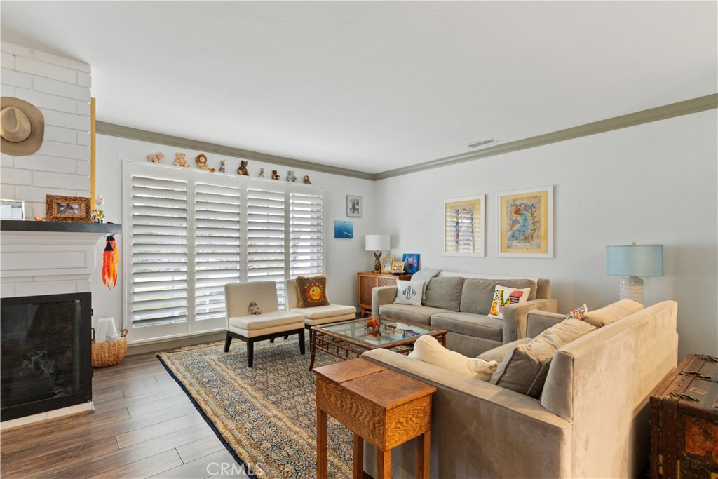 419 Gloucester Drive Costa Mesa, CA 92627 - Photo 4 of 51 a living room with furniture and a fireplace