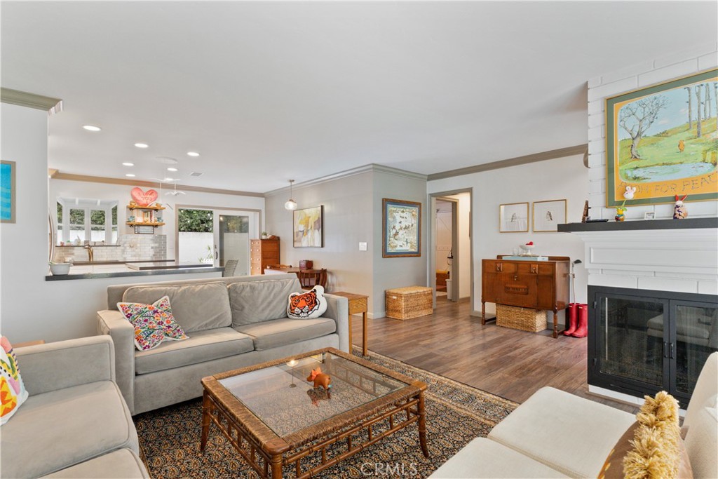 419 Gloucester Drive Costa Mesa, CA 92627 - Photo 5 of 51 a living room with furniture a fireplace and a flat screen tv