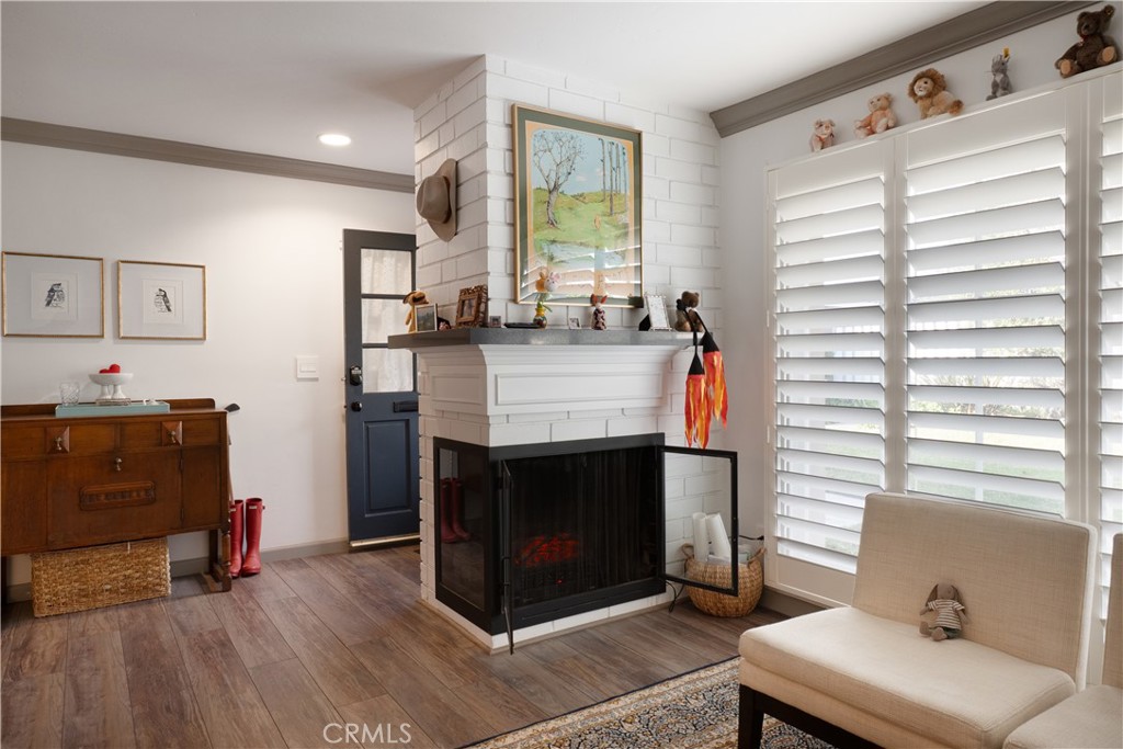 419 Gloucester Drive Costa Mesa, CA 92627 - Photo 6 of 51 a living room with furniture and a fireplace