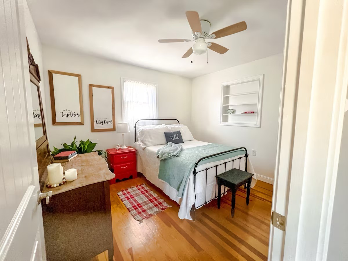 701 Morton Road Murfreesboro, TN 37128 - Photo 13 of 24 a bedroom with a bed and a chandelier