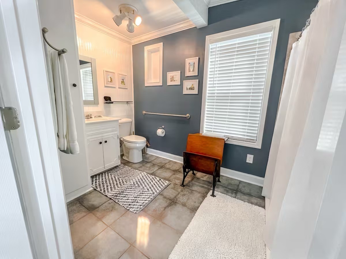 701 Morton Road Murfreesboro, TN 37128 - Photo 16 of 24 a bathroom with a toilet a sink and a mirror