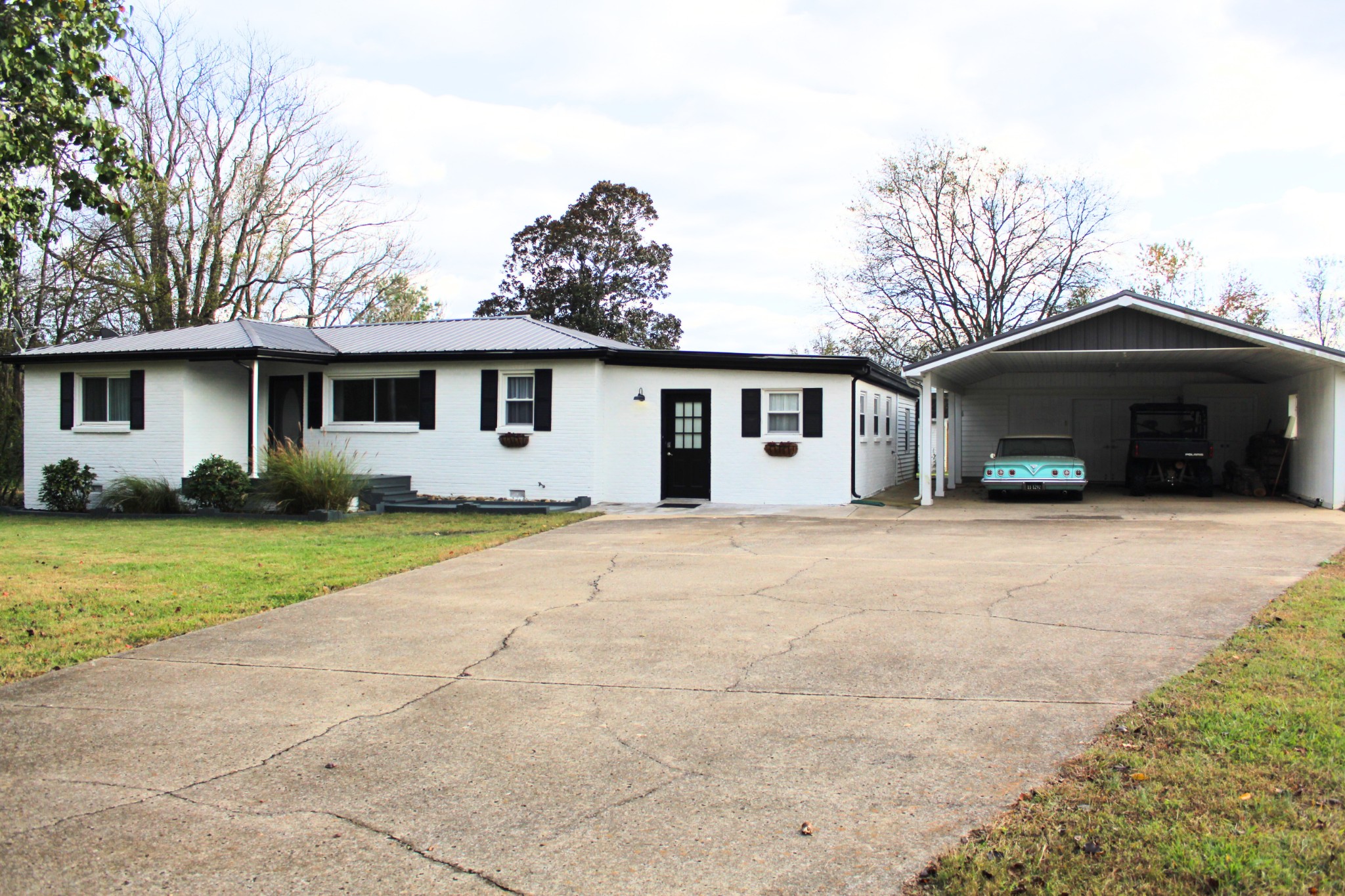 701 Morton Road Murfreesboro, TN 37128 - Photo 22 of 24 a front view of a house with yard and garage