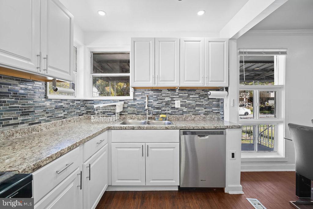 2010 Ray Leonard Road Landover, MD 20785 - Photo 9 of 43 a kitchen with stainless steel appliances granite countertop a sink and cabinets