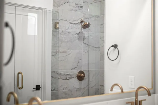 a bathroom with a double vanity sink mirror and