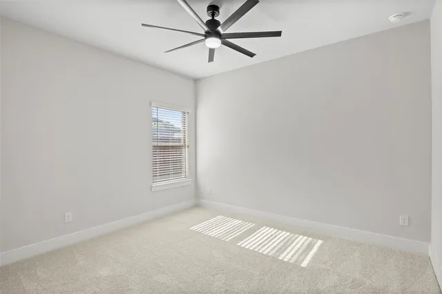 a bathroom with a toilet a sink a mirror and vanity
