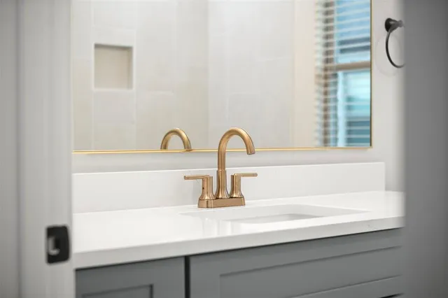 a bathroom with a sink a shower and a bathtub